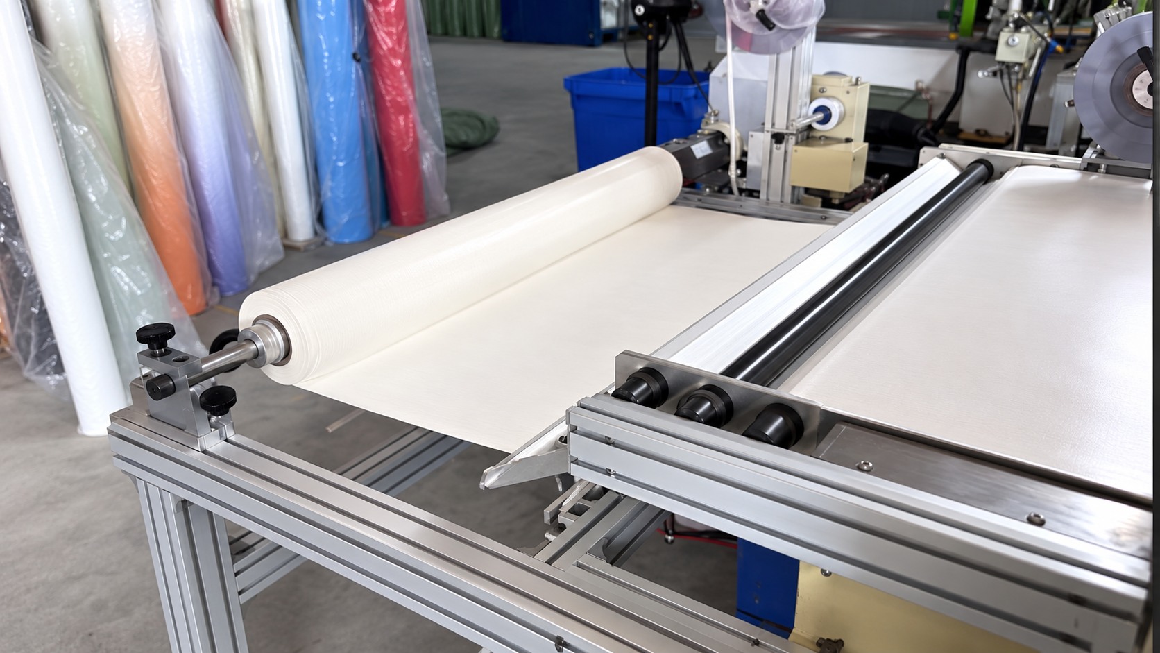 Material roll on a metal-framed machine