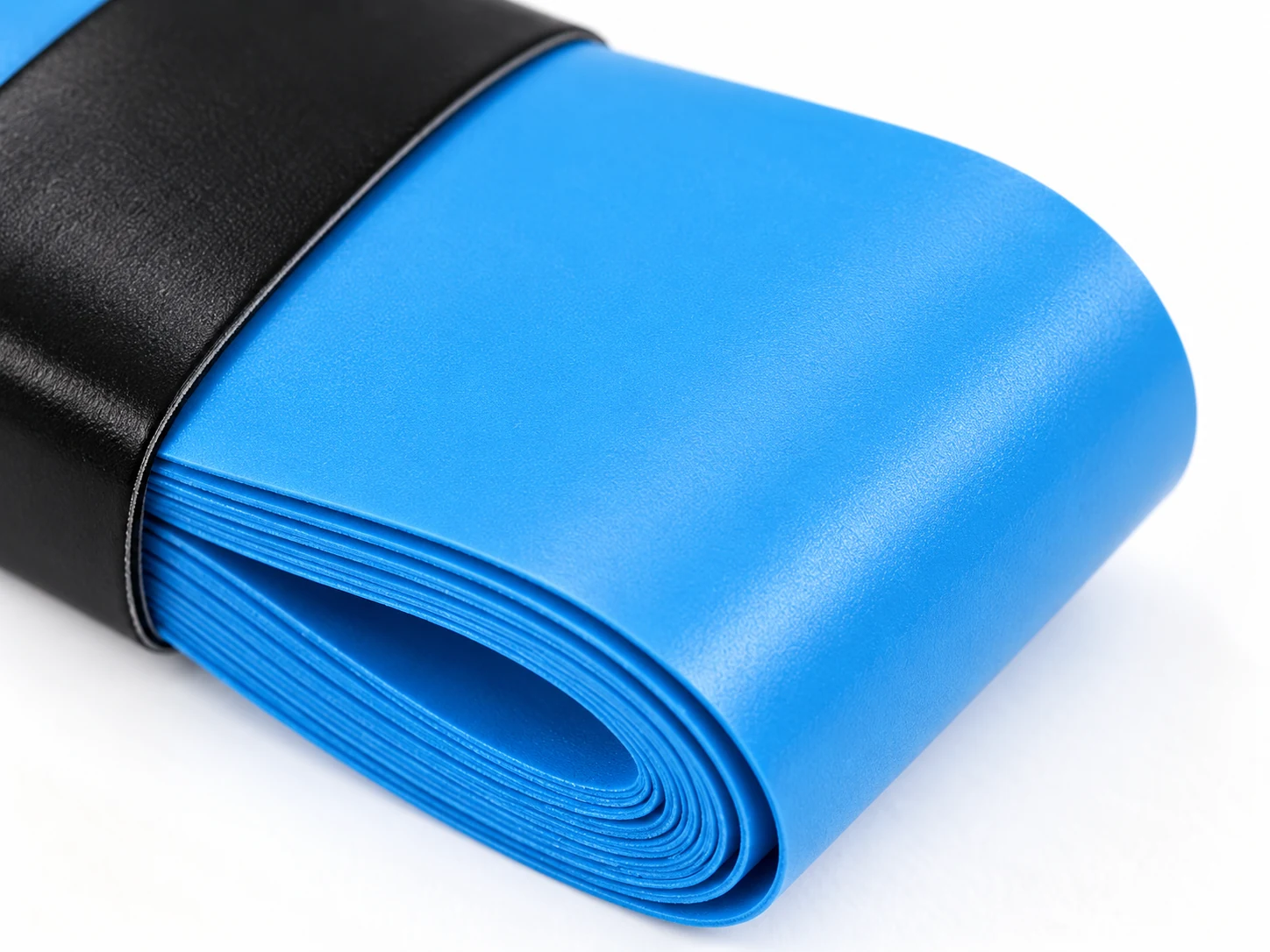Close-up of the OG-D01 blue ultra-thin dry overgrip surface and roll edge
