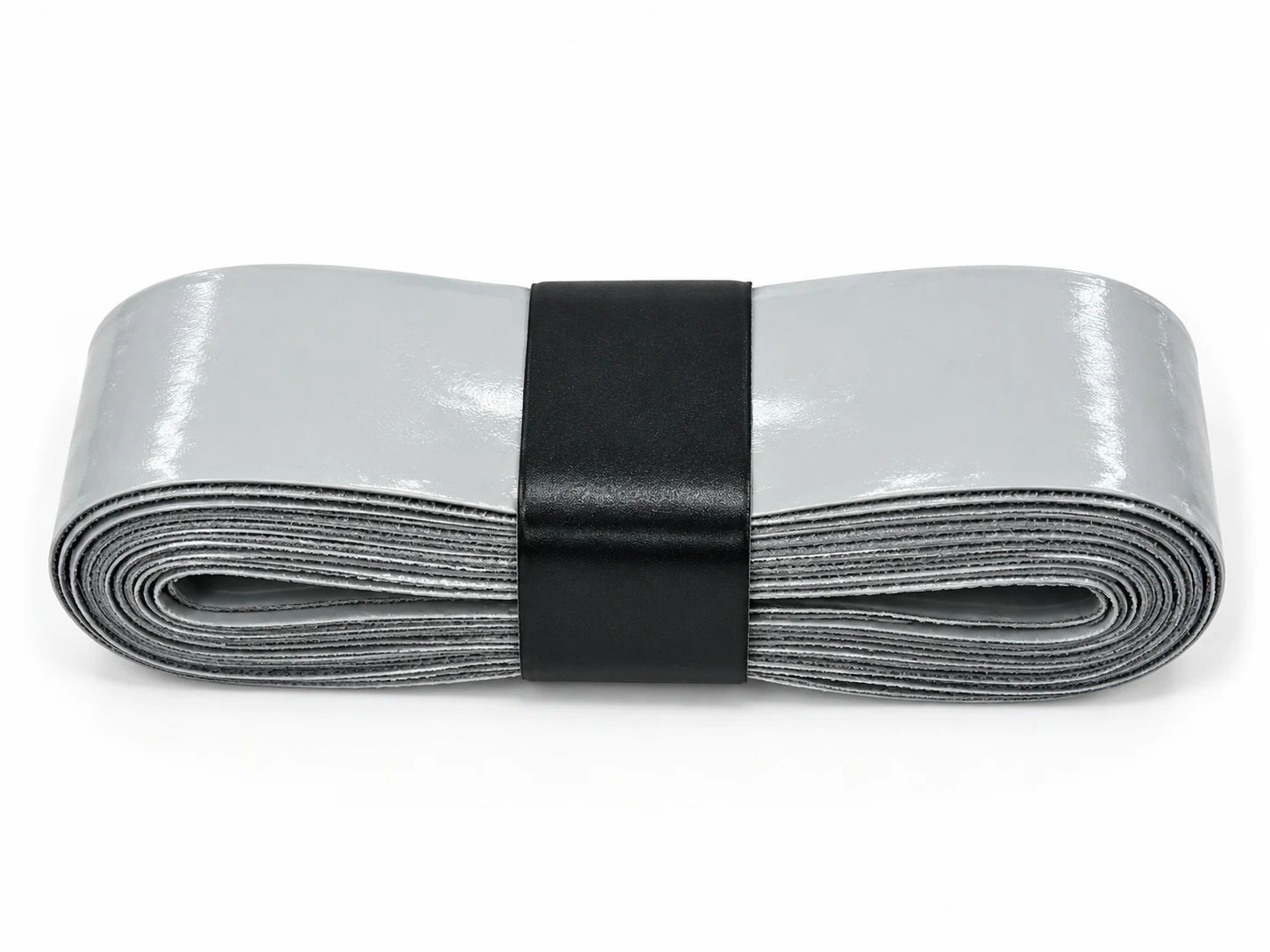 Rotolo di overgrip compatto dal tocco tendenzialmente asciutto grigio argento OG-F01 disposto in piano