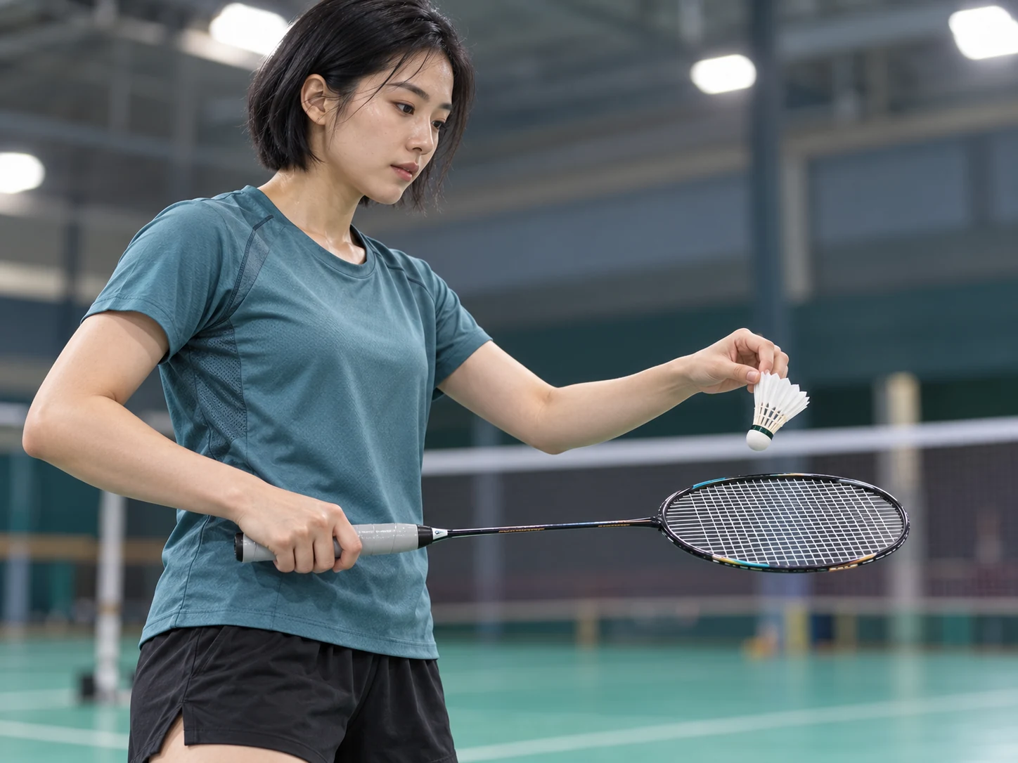 A badminton player holding a racket with OG-F01 silver-gray firm dry-ish overgrip