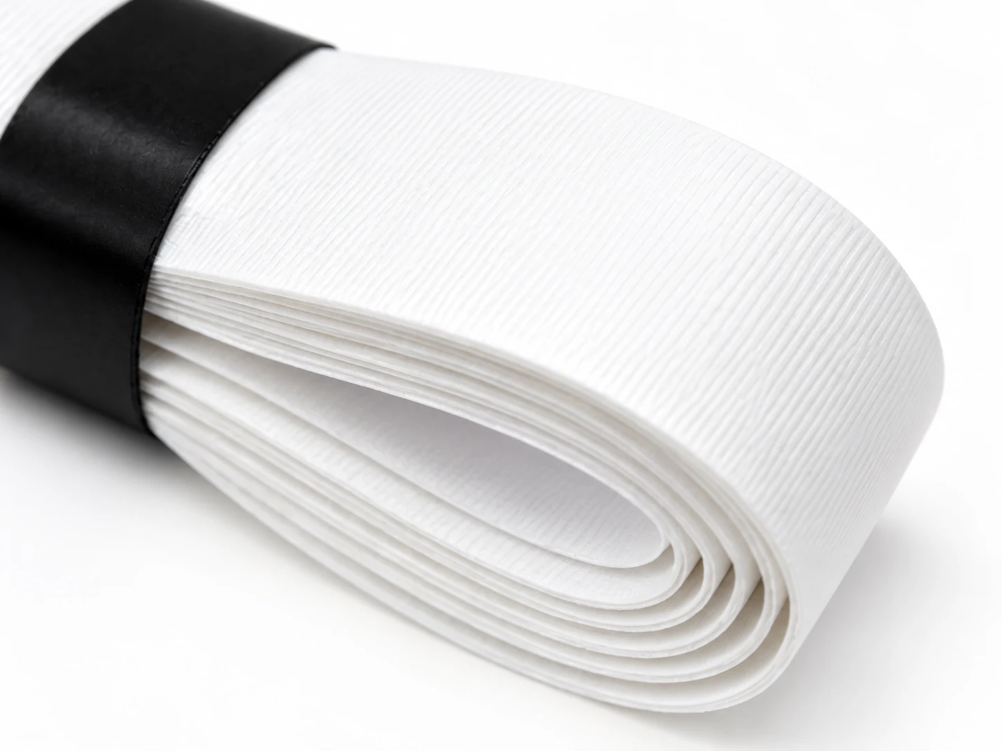 Close-up of the RG-MT01 white mild tacky replacement grip surface and roll edge
